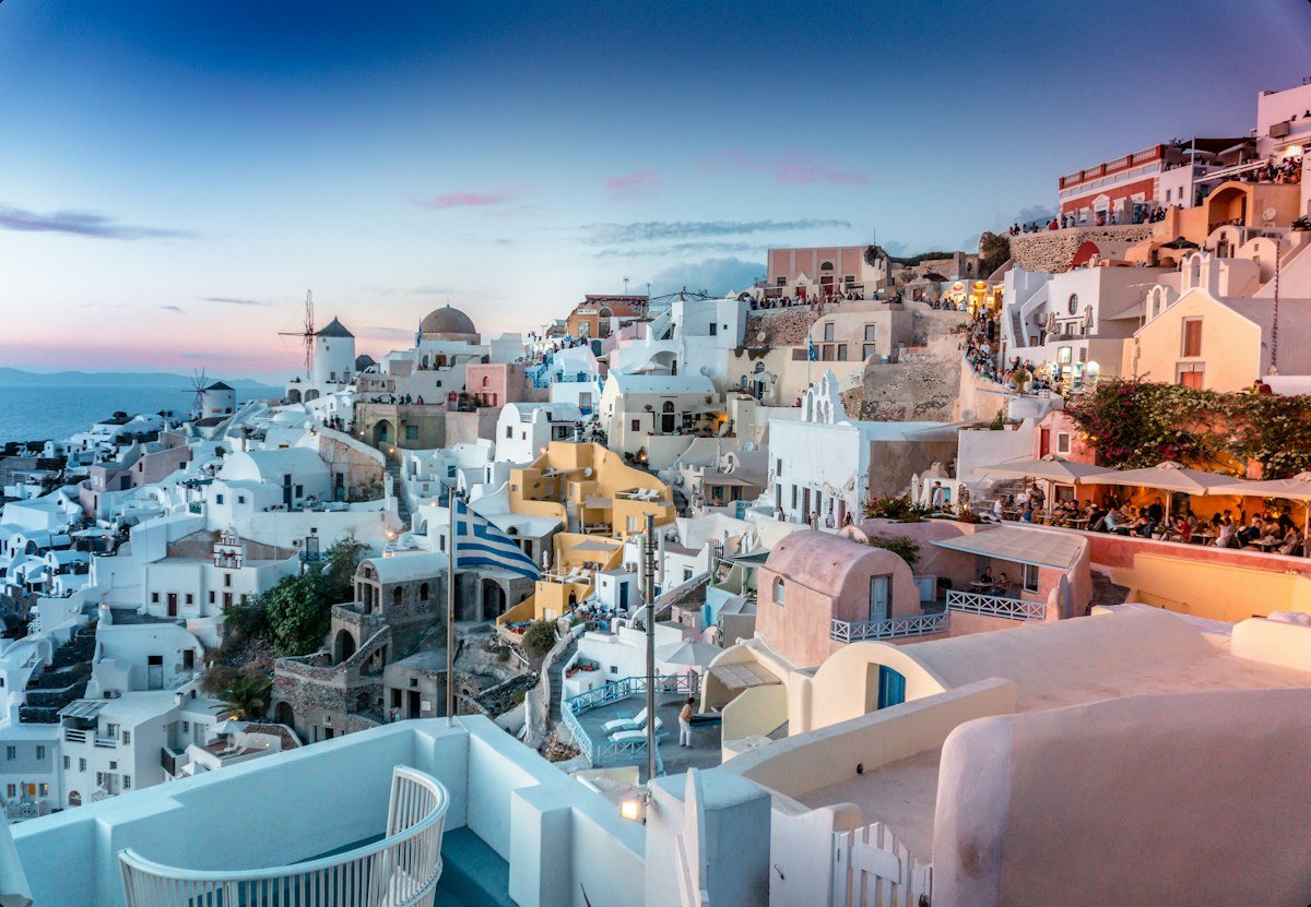 Spectacular cliffside view of Santorini Greek Isles overlooking cruise ships anchored in the caldera