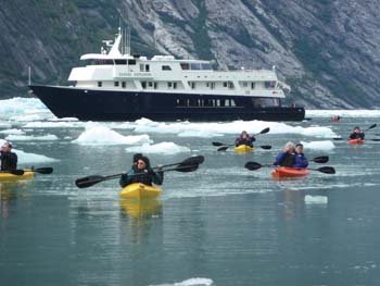 UnCruise Adventures small expedition ship surrounded by dramatic Alaskan wilderness